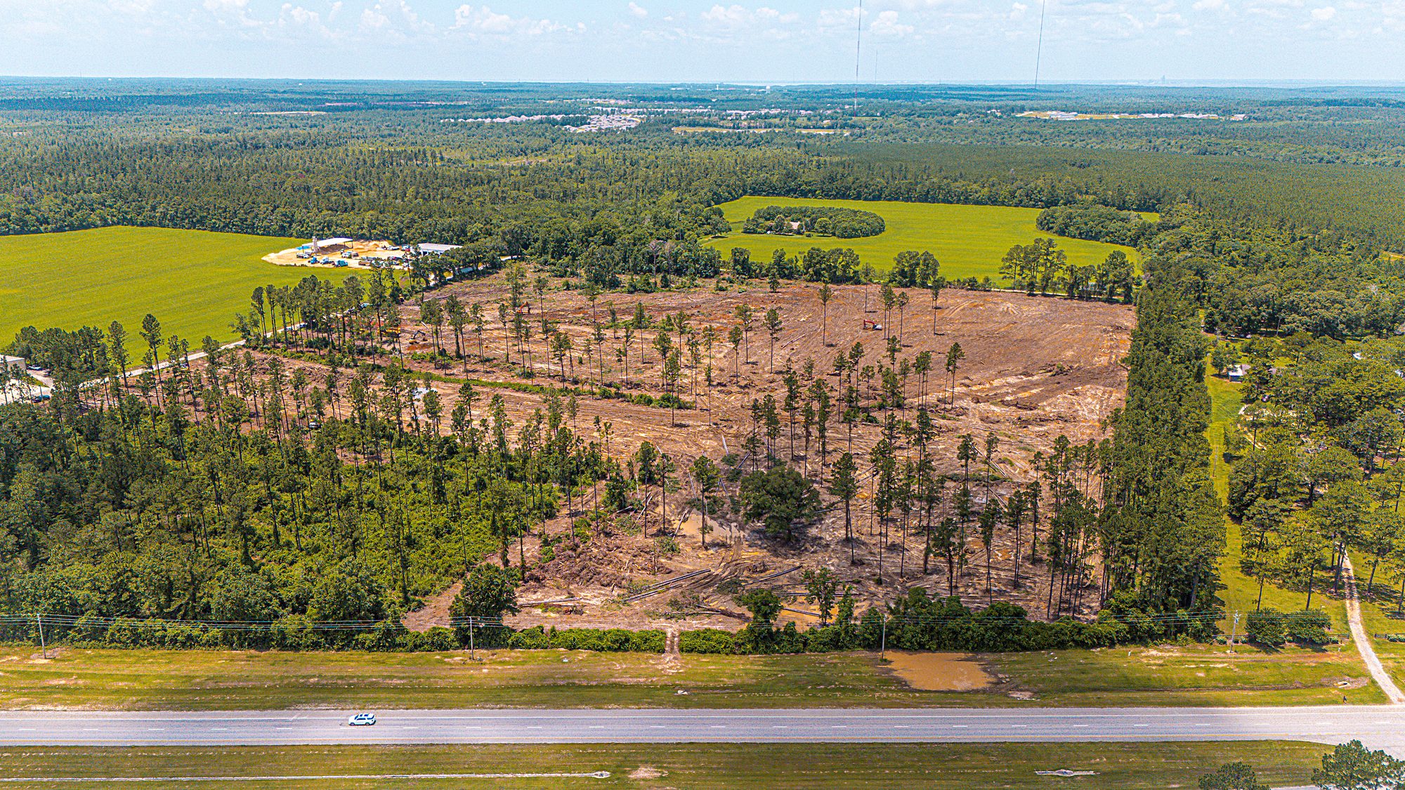 Aerial view of a large commercial facility site worked by H&W Services
