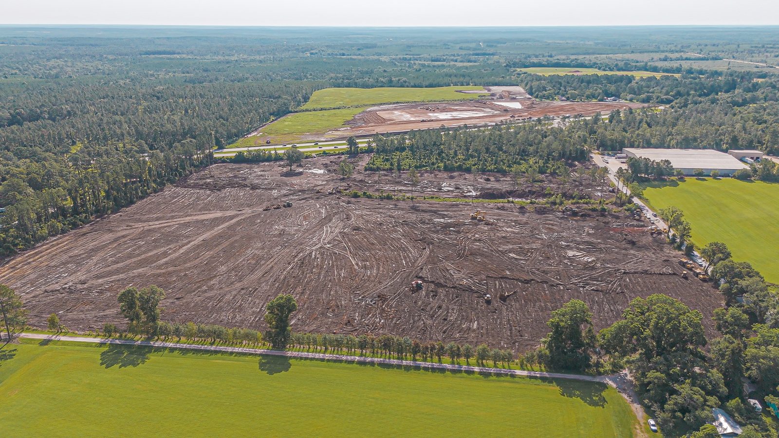 Aerial view of a large-scale earthwork and grading site worked by H&W Services